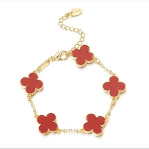 Red four leaf clover gold tone bracelet